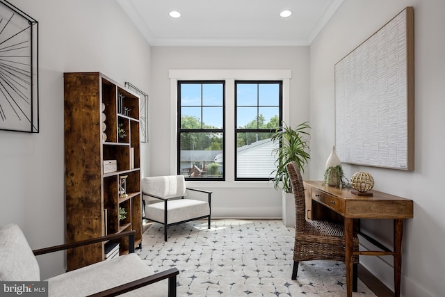 sitting room featuring crown molding