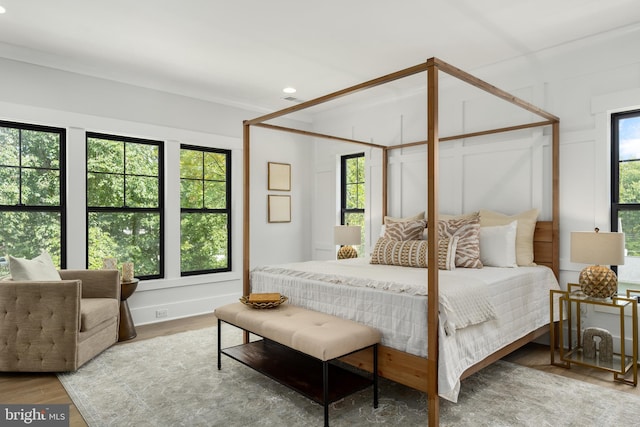 bedroom with wood-type flooring