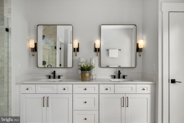 bathroom featuring vanity and an enclosed shower