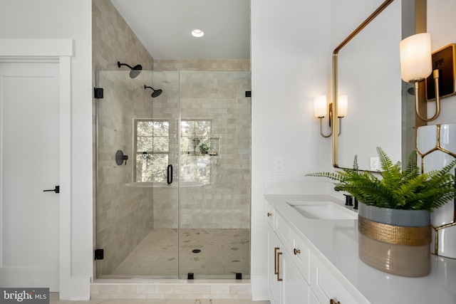 bathroom with vanity and an enclosed shower