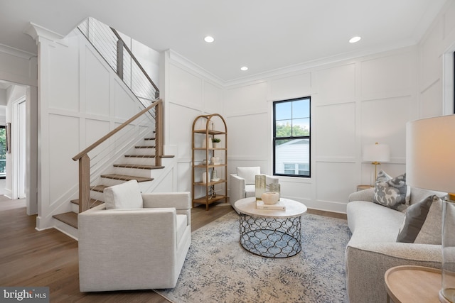 living room with ornamental molding and dark hardwood / wood-style flooring