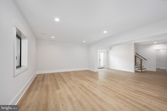 spare room featuring light hardwood / wood-style floors