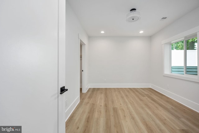 empty room with light wood-type flooring