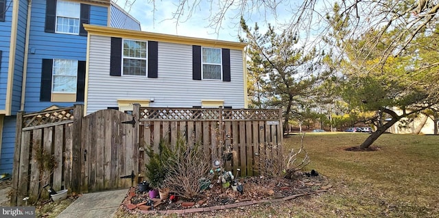 view of side of home with a lawn