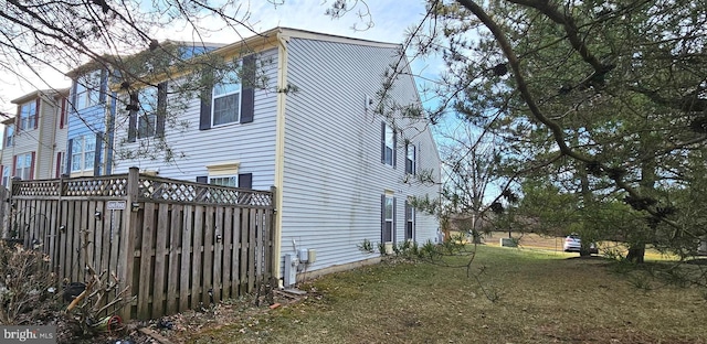 view of side of property featuring a yard