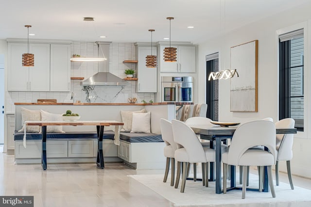 dining space featuring light hardwood / wood-style flooring and breakfast area