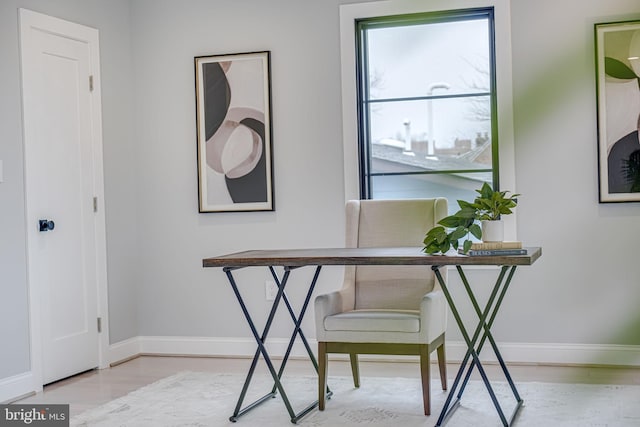 office space with light hardwood / wood-style flooring