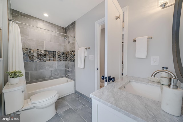 full bathroom featuring vanity, tile patterned floors, toilet, and shower / tub combo with curtain