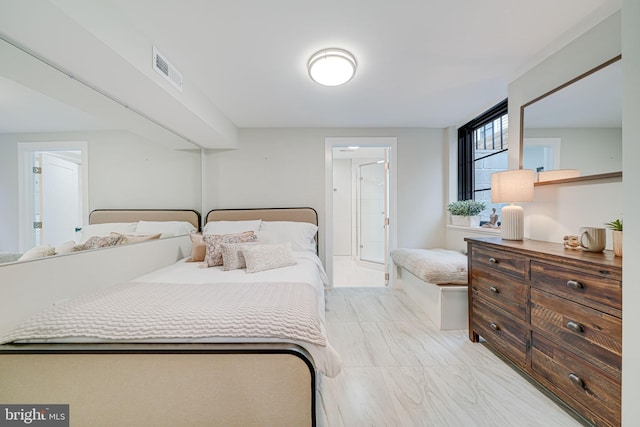 bedroom featuring connected bathroom