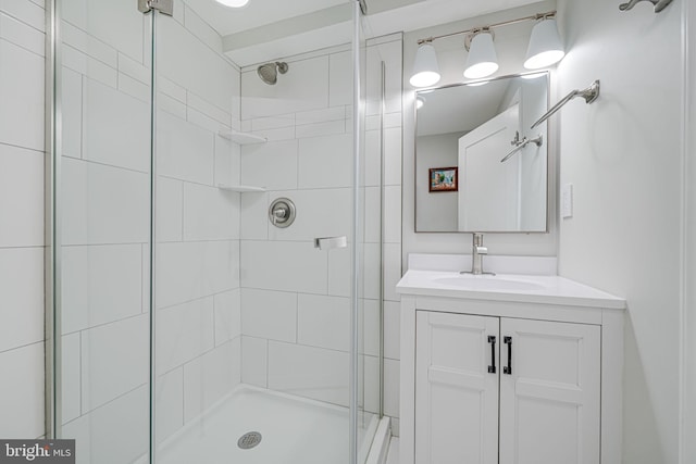 bathroom featuring vanity and an enclosed shower