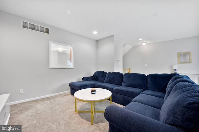 living area featuring recessed lighting, light carpet, visible vents, and baseboards