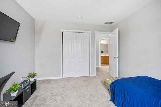 bedroom with light carpet, baseboards, visible vents, and a closet