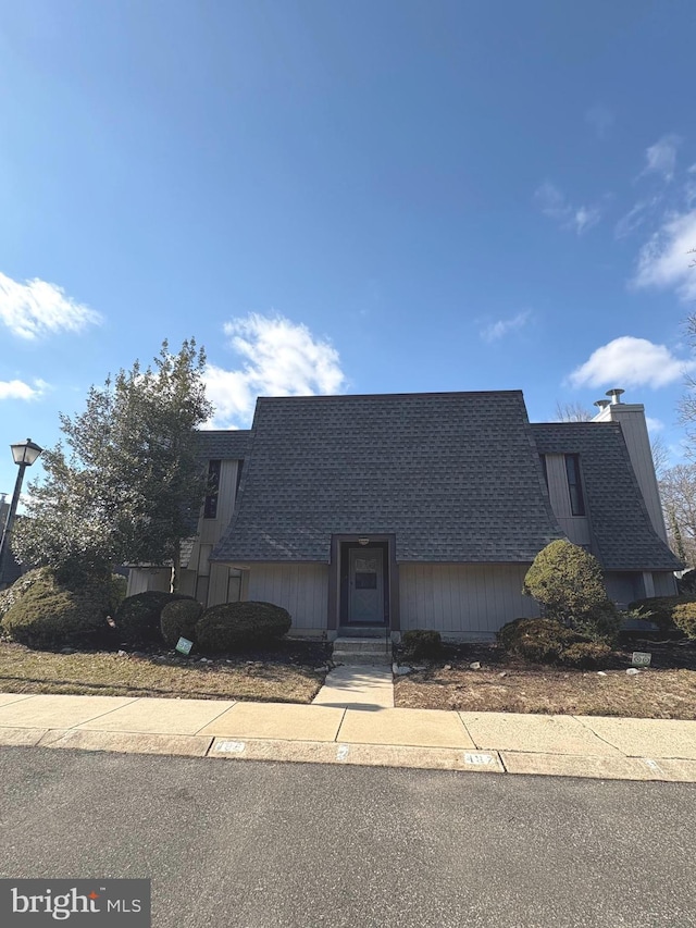 view of front of home featuring roof with shingles