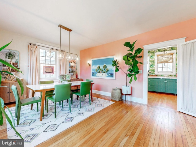 dining room featuring plenty of natural light and light wood-type flooring