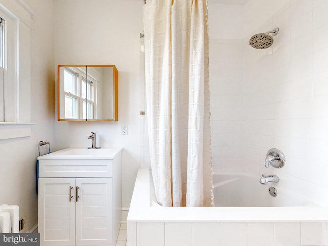 bathroom featuring vanity, radiator, and shower / tub combo