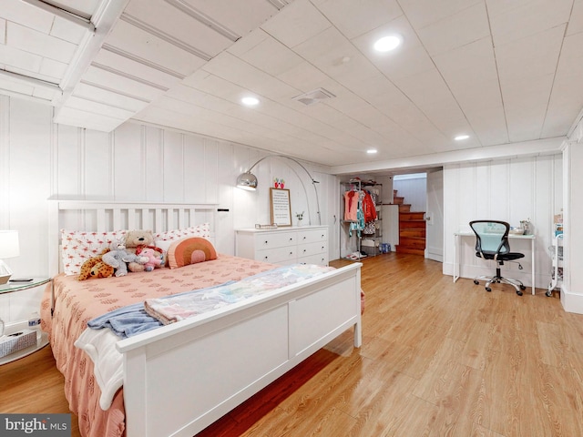 bedroom with light hardwood / wood-style flooring