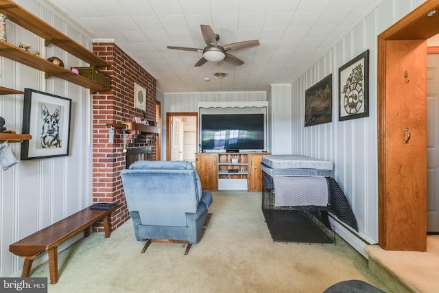 interior space featuring a fireplace, light colored carpet, and ceiling fan