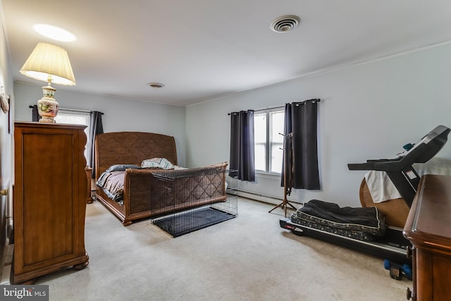 bedroom featuring baseboard heating, ornamental molding, and light carpet