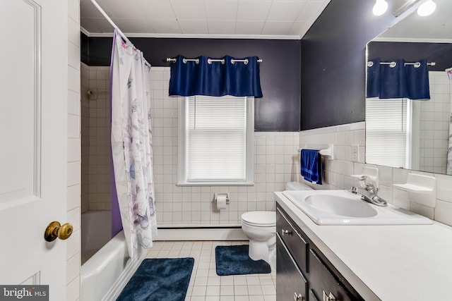 full bathroom featuring shower / tub combo with curtain, tile walls, baseboard heating, vanity, and tile patterned flooring