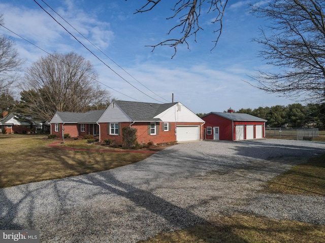 single story home featuring a garage and a front lawn