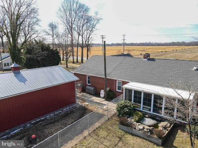 exterior space featuring a sunroom