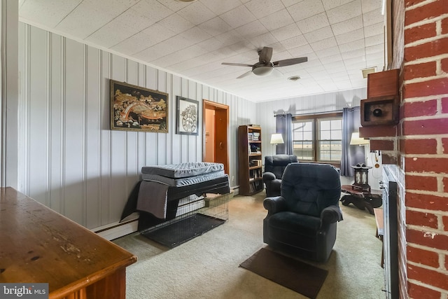 living room featuring a baseboard radiator, carpet flooring, and ceiling fan