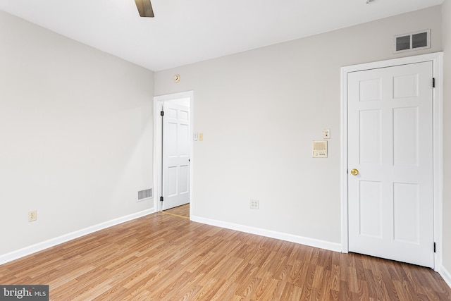 unfurnished room featuring ceiling fan and wood-type flooring