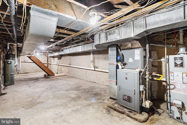 basement featuring water heater and heating unit