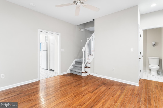 interior space with ceiling fan and light hardwood / wood-style floors