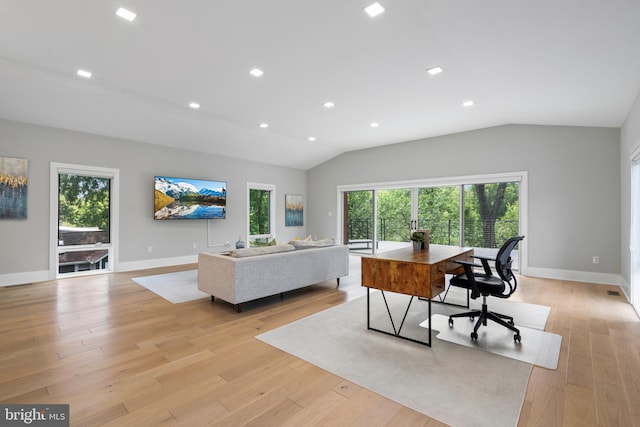 office area featuring lofted ceiling and light hardwood / wood-style floors