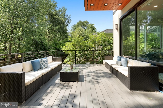 wooden deck with an outdoor hangout area