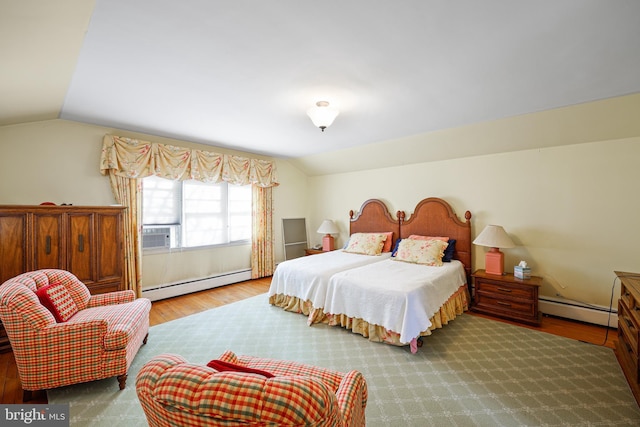 bedroom featuring baseboard heating, vaulted ceiling, cooling unit, and hardwood / wood-style flooring