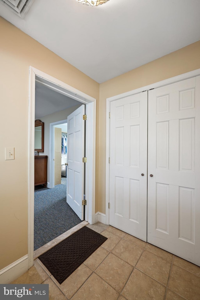 interior space with light tile patterned floors