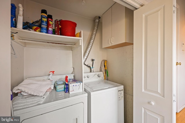 laundry room featuring cabinets and independent washer and dryer