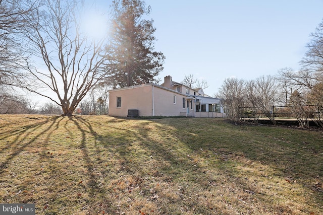 view of yard with central AC