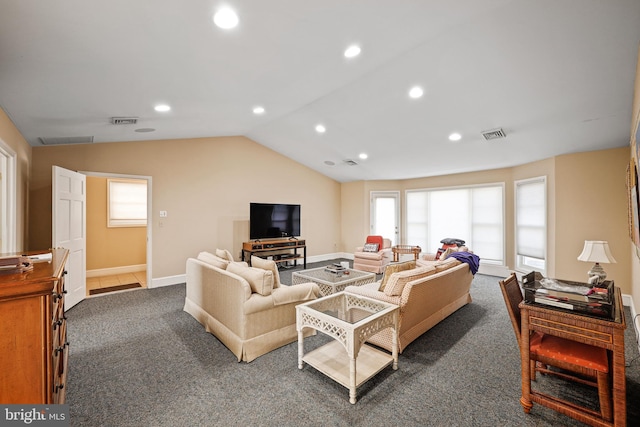 carpeted living room with vaulted ceiling