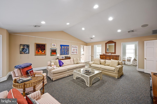 living room with dark carpet and vaulted ceiling