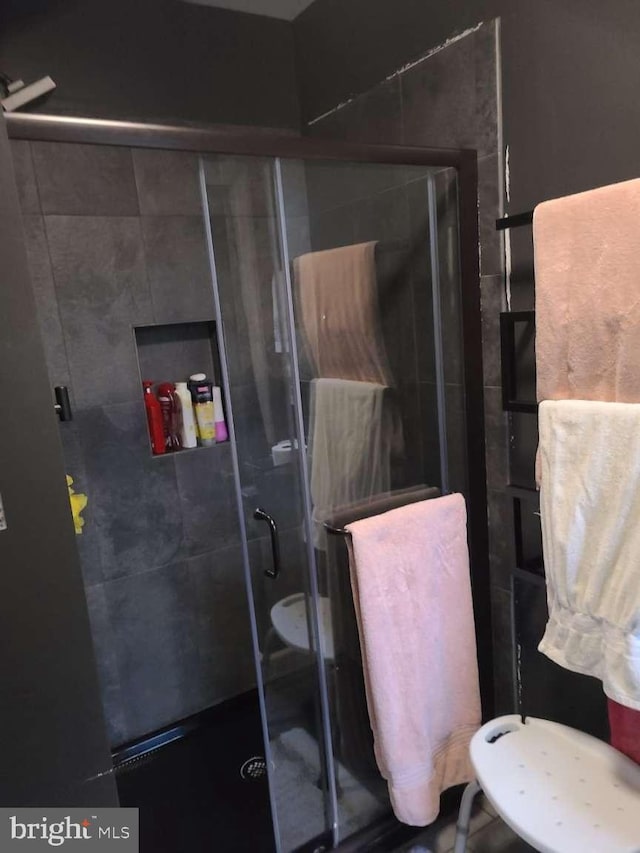 full bathroom with a shower stall