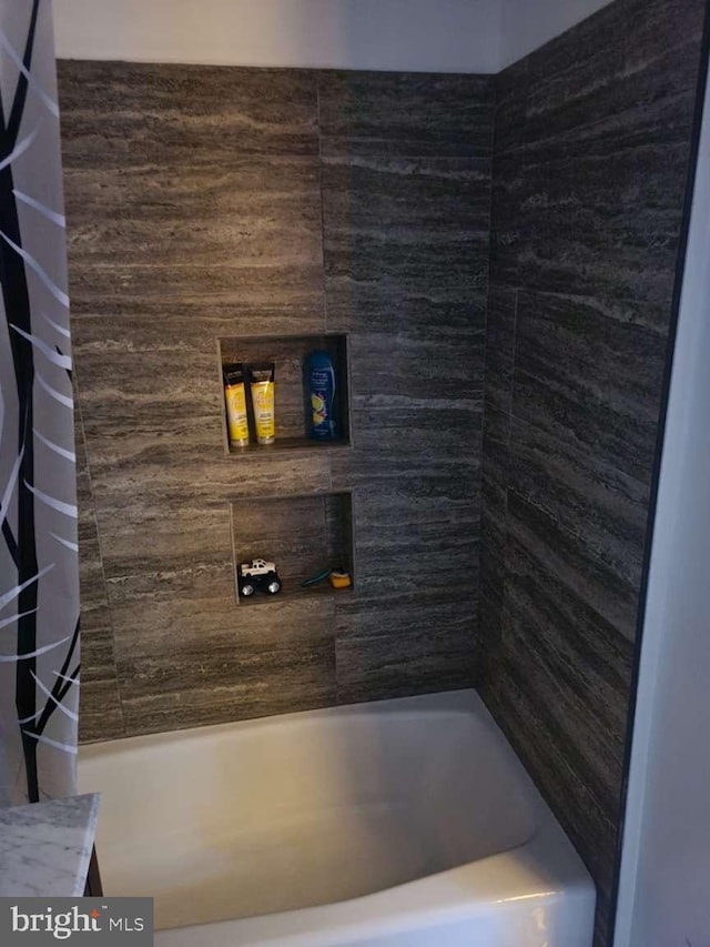 full bathroom with a shower with shower curtain