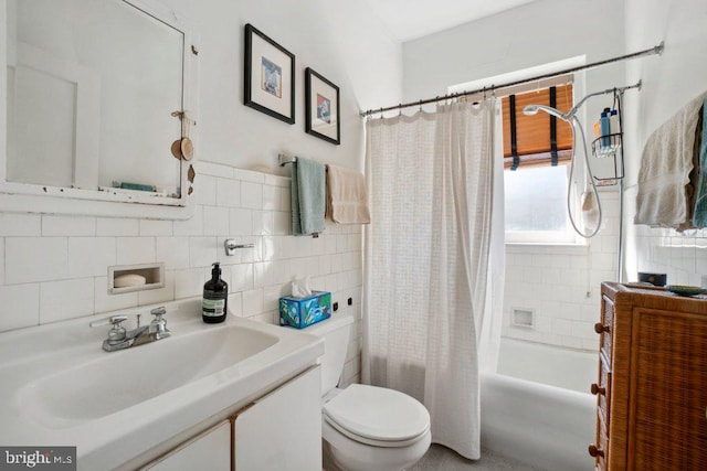 full bathroom featuring vanity, tile walls, shower / bath combination with curtain, and toilet