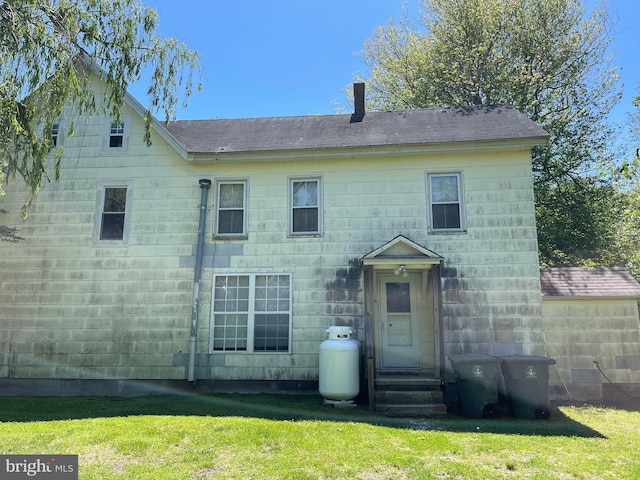 10037 Main St, Berlin, MD 21811 - back of property featuring a yard and roof with shingles
