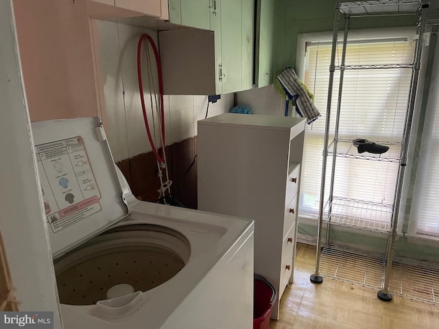 10037 Main St, Berlin, MD 21811 - laundry area featuring cabinet space and washer / dryer