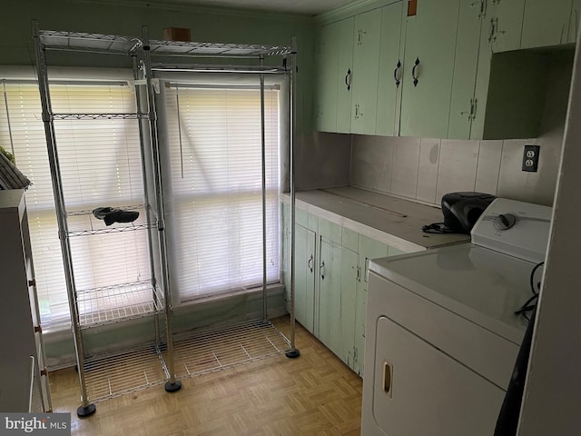 10037 Main St, Berlin, MD 21811 - laundry area featuring washer / clothes dryer, cabinet space, and ornamental molding