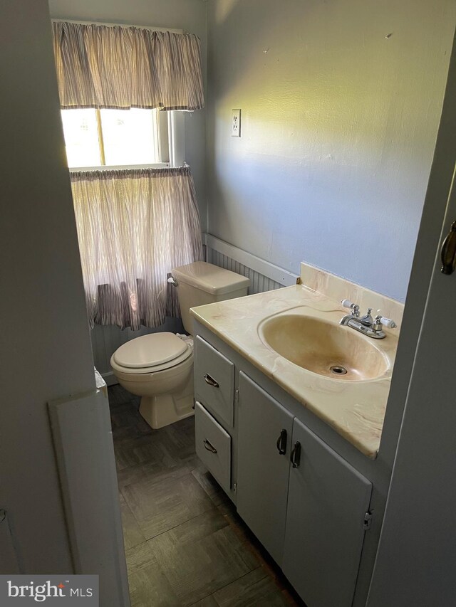 10037 Main St, Berlin, MD 21811 - half bathroom featuring vanity and toilet