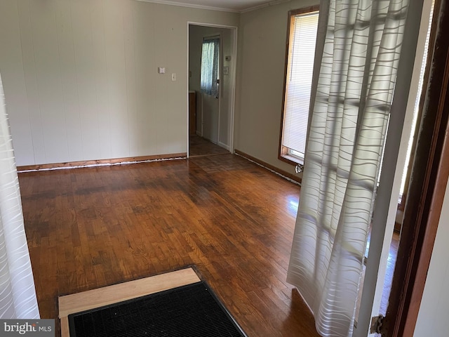 10037 Main St, Berlin, MD 21811 - empty room featuring ornamental molding, wood-type flooring, and baseboards