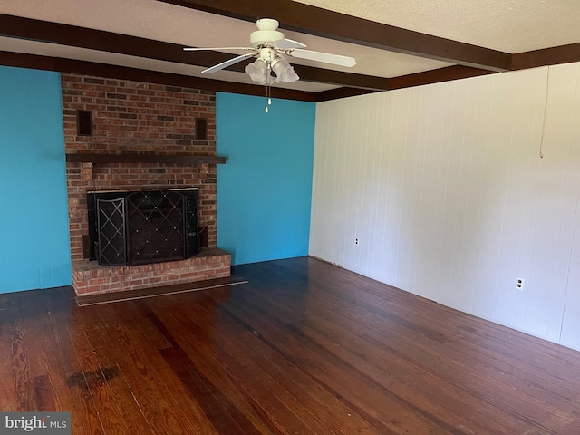 10037 Main St, Berlin, MD 21811 - unfurnished living room featuring beam ceiling, hardwood / wood-style flooring, a ceiling fan, and a fireplace