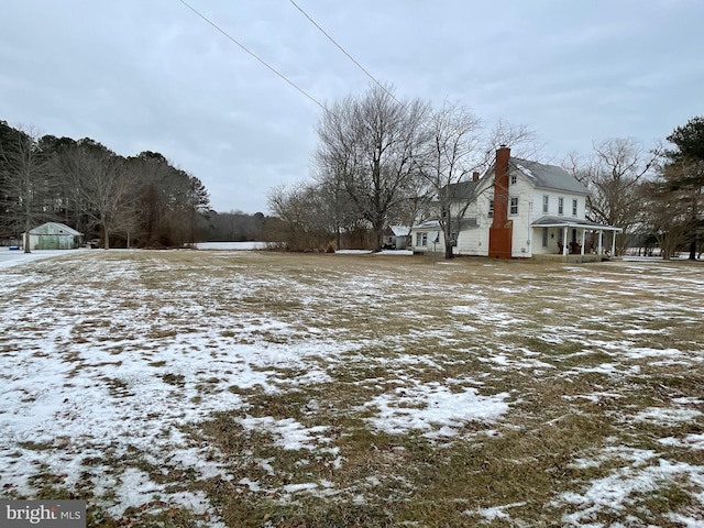 view of yard covered in snow