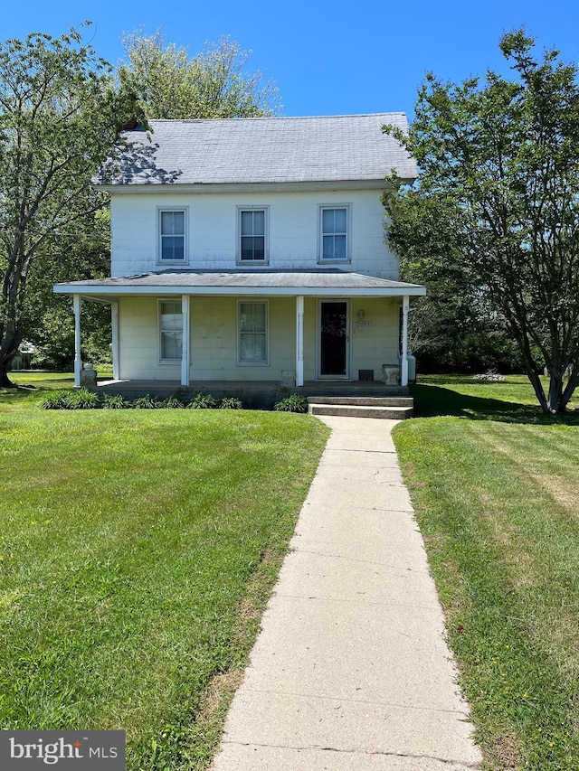 10037 Main St, Berlin, MD 21811 - view of front of home featuring a porch and a front yard