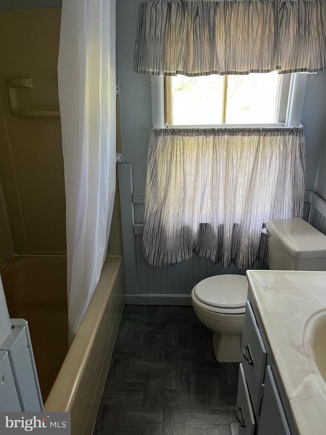 10037 Main St, Berlin, MD 21811 - full bath with toilet, vanity, and shower / bathtub combination with curtain
