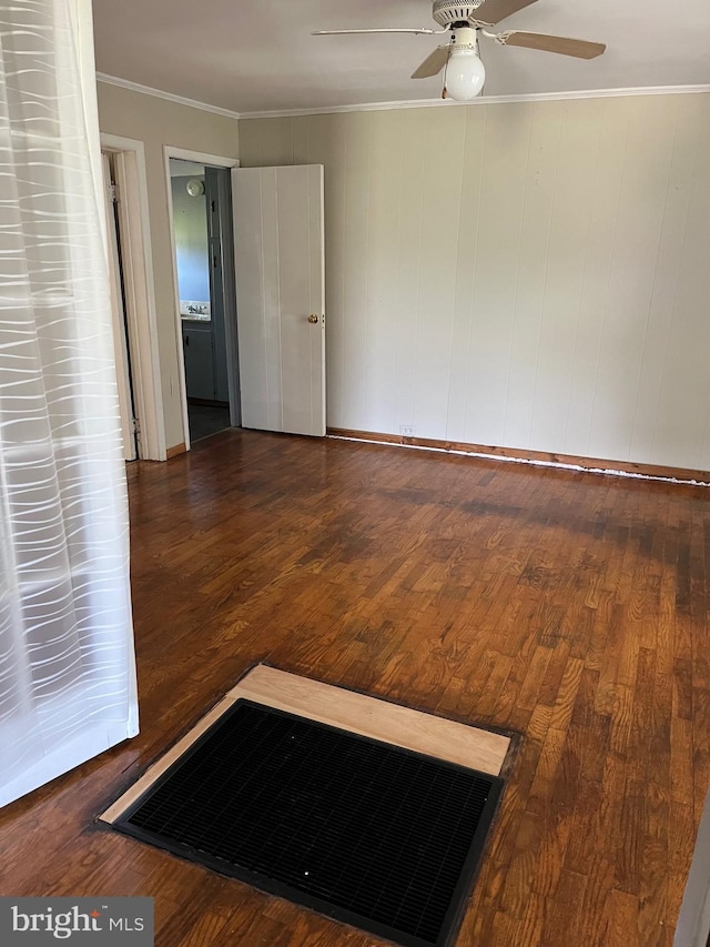 10037 Main St, Berlin, MD 21811 - spare room with a ceiling fan, wood finished floors, and crown molding